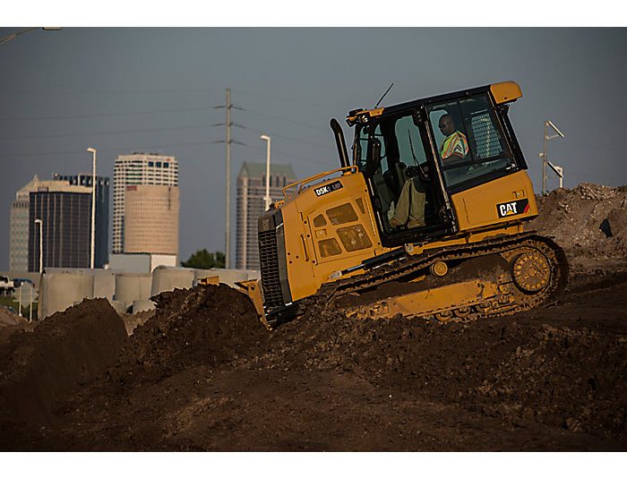 Track type Tractor CAT D5K in action at jobsite